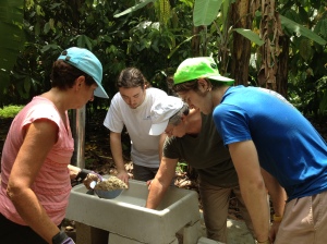 Sherri, Jake, LaVerne and Michael putting together the stove. They became quite good at this work! 